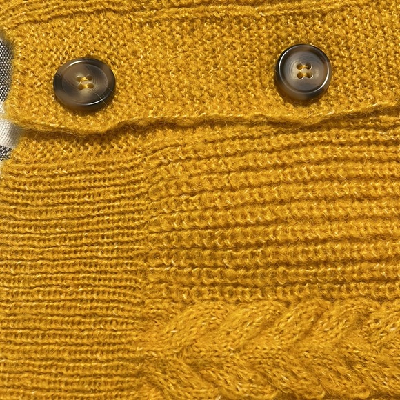 The color of the cardigan is yellow with buttons down the middle. - Picture 2 of 7
